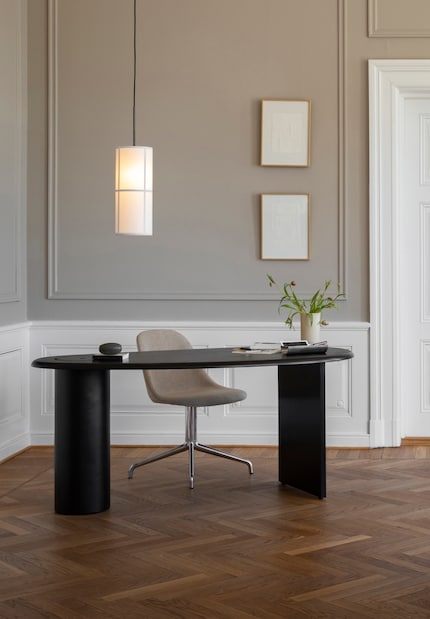 The curves of a round table make your room look more inviting.