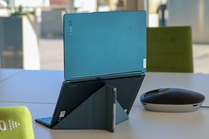The Yoga Book 9 on its stand.