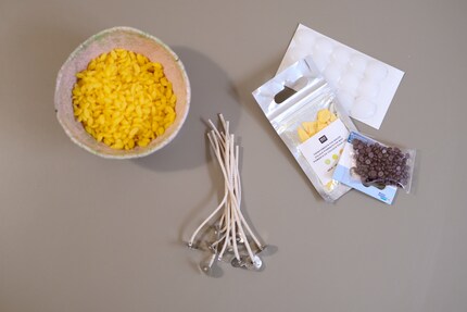 From left to right: wax, wicks, wax dye and adhesive wax plates.