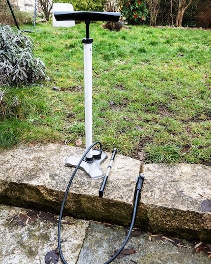 Size comparison between a mini pump and a floor pump.