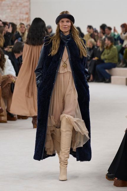You usually only tend to see trouser hems tucked into boots.