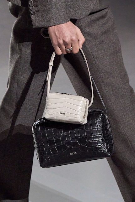 Dior knows: bag-layering is also in fashion for men.