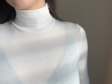 Without a seamless top: the bra is visible under the thin fabric.