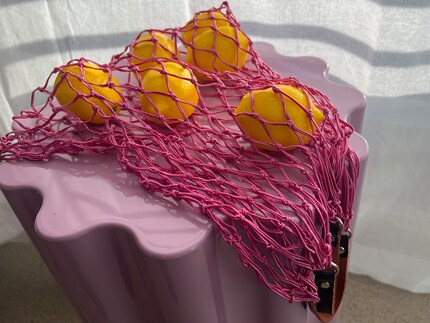 Cedon’s netted shopping bag looks very small, but it can expand.