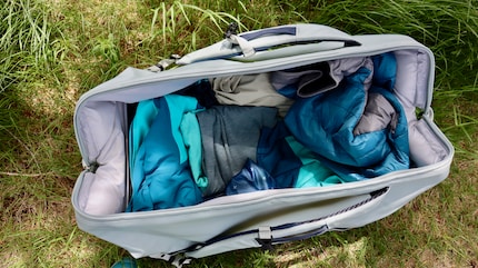 Outdoor clothes for all eventualities disappear into the bag’s sizeable belly.