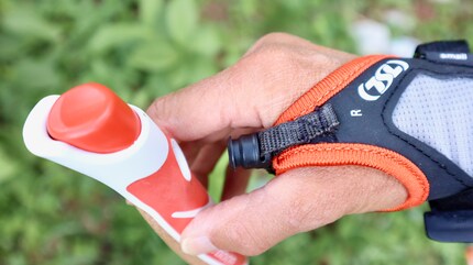 Simply put it in the hole and the magnetic mechanism will secure it. To release it, just press the red button.