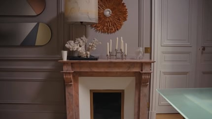Carefully placed decorations and curtains create a living room look. 