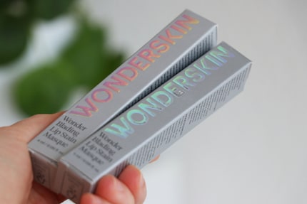 The lettering on the cardboard packaging is holographic.
