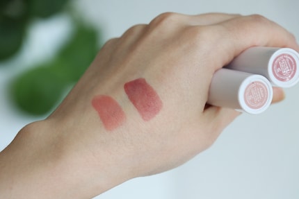 On my skin, the swatches come pretty close to the colour displayed on the stickers. On my lips, however, they’re much darker.