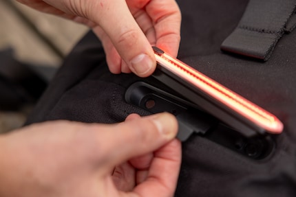 There is a dedicated recess for the Unit1 smart light on the backpack. If you don't have a smart light, simply leave the plastic cover in place.