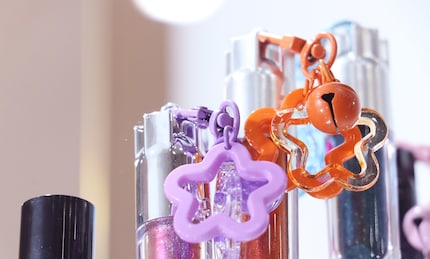 Sweet extras: plastic flowers and bells, exhibited at Cosmoprof by Minyao Cosmetics.
