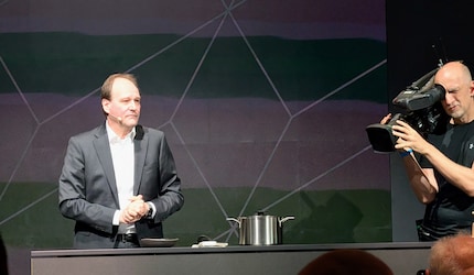 Miele Managing Director Markus Miele gets things cooking on stage.